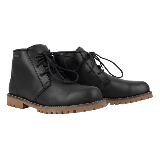 Black leather half motorcycle boots with a chukka style, featuring round laces and a rugged brown rubber sole for traction.