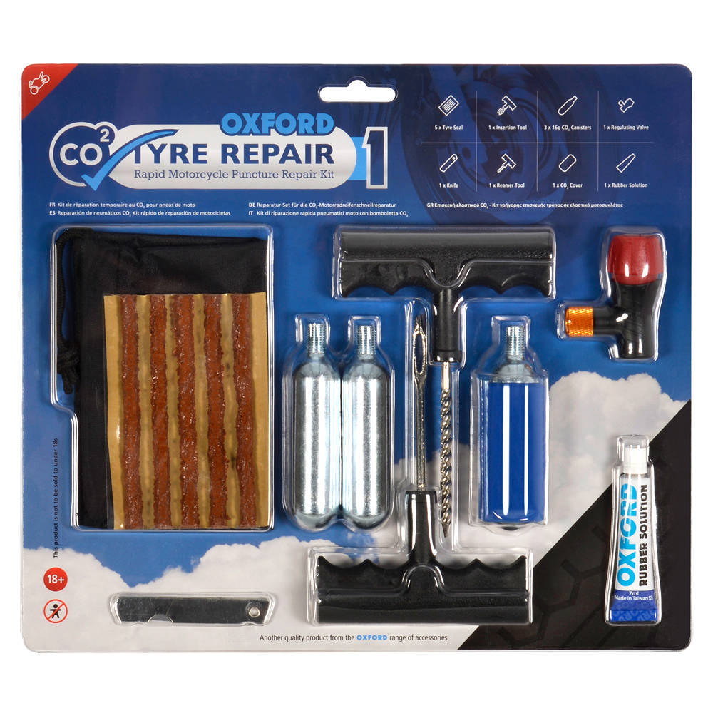 Oxford CO2 Motorcycle Tyre Repair Kit featuring a blue and black packaging, includes tire plugs, CO2 canisters, a tire reamer, and a valve tool, all essential for quick puncture repairs.