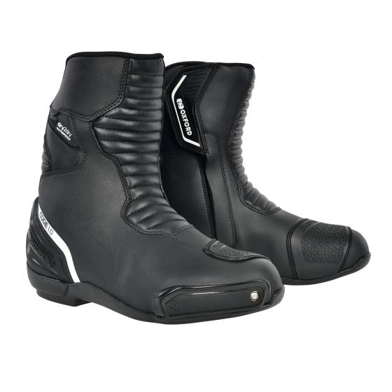Black and white mid-calf motorcycle boots featuring a sleek design, textured panels, reinforced toe, and a secure fastening system, size 46 (UK 12).