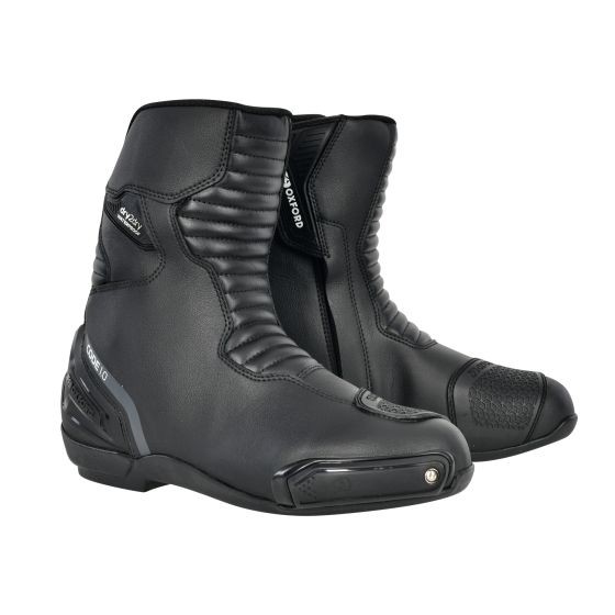 Stealth black mid-calf motorcycle boots made from durable material, featuring textured panels, reinforced toe, and a sleek design, size 43 (UK 9).