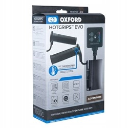 Black heated grips with a textured surface, featuring a digital controller and adjustable temperature settings, packaged in a blue and white box labeled "OXFORD HOTGRIPS EVO ADVENTURE."