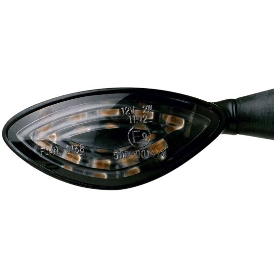 Black plastic LED indicator with an oval shape, featuring amber lights and clear lens, marked with specifications including voltage and model number.