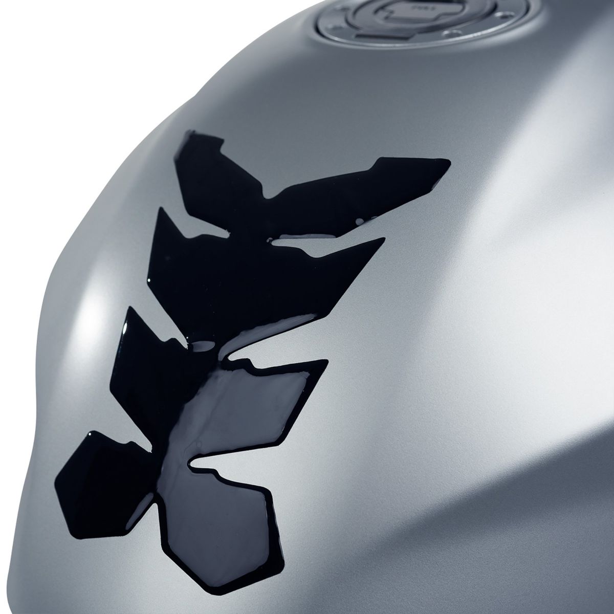 Silver tank protector featuring a black 3D gel design in the shape of an abstract mantis, designed for motorcycle use, providing protection and grip.