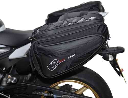 Black Oxford OL315 Tail Bag with a sleek design, featuring a textured surface, reflective accents, and a zippered compartment, mounted on a motorcycle.