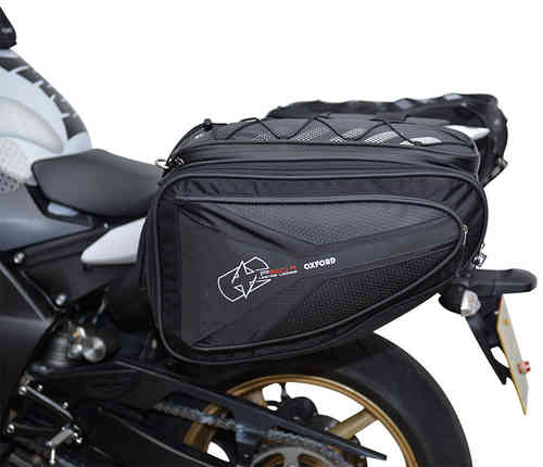 Black Oxford P60R saddle bags with a 30-liter capacity, featuring a sleek design, durable material, and mesh detailing, mounted on a motorcycle.
