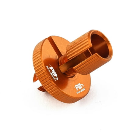 Aluminium cable adjuster in vibrant orange, featuring a textured grip and a central opening for easy installation, marked with the Pro-Bolt logo.
