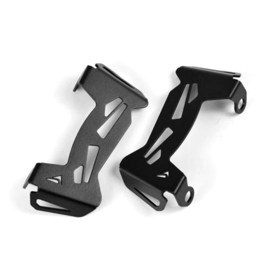Black metal brake caliper guards with a sleek design and cut-out patterns, designed for motorcycle protection and durability.