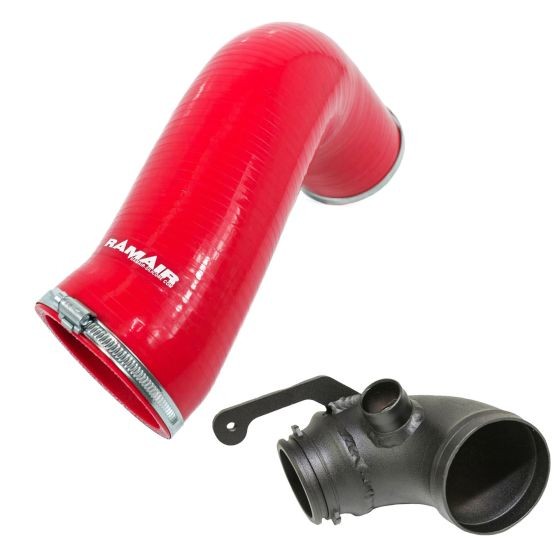 Red silicone intake hose with a turbo elbow, featuring a smooth finish and metal clamps, designed for enhanced airflow in automotive applications.