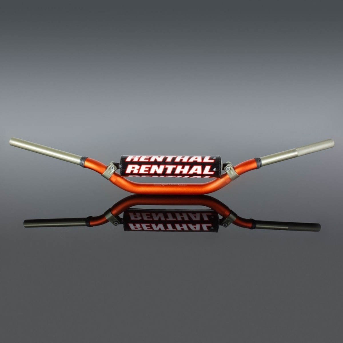 Renthal Volant MX Twinwall handlebar in orange and silver, featuring a sturdy aluminum construction with a wide grip area and the "RENTHAL" logo prominently displayed.
