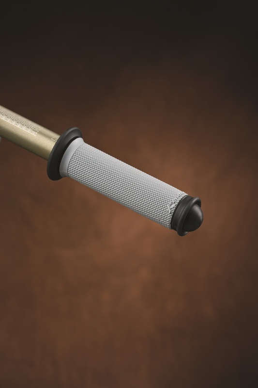 Grey and black Renthal Road Series grips with a full diamond texture, featuring a rubberized end cap and a durable design for enhanced grip and control.