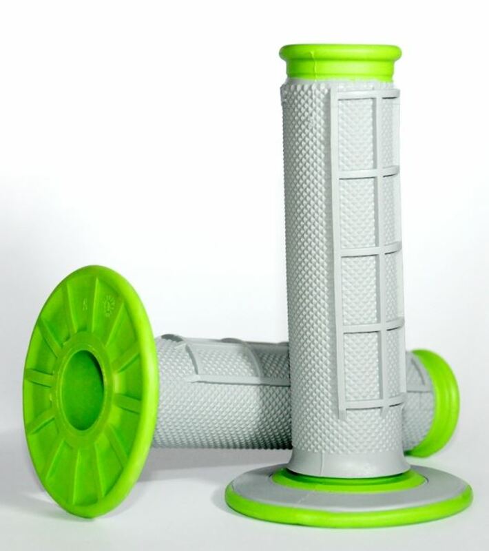 Grey dual compound grips with a half waffle texture and bright green end caps, designed for enhanced grip and comfort in motocross applications.