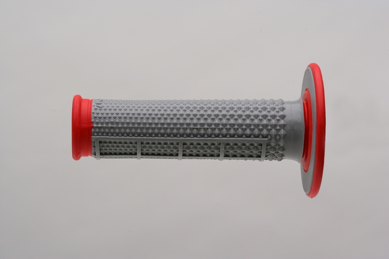 Gray rubber MX grip with a half waffle pattern and red end caps, designed for enhanced grip and control in motocross applications.