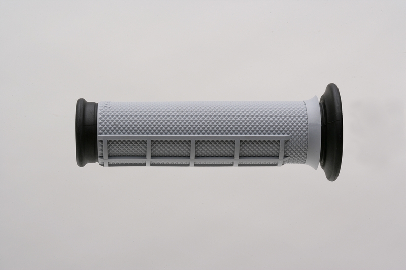 White dual compound ATV grip with a half waffle texture, featuring a black end cap and grip section for enhanced control and comfort.