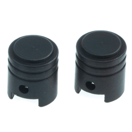Black alloy valve caps with a piston shape, featuring a smooth top and a cut-out design at the base for easy installation and removal.