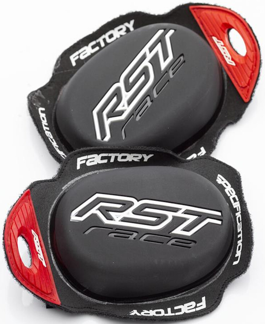 Black RST Factory knee sliders with a smooth surface, featuring white "RST" and "race" logos, and red accents for secure attachment.
