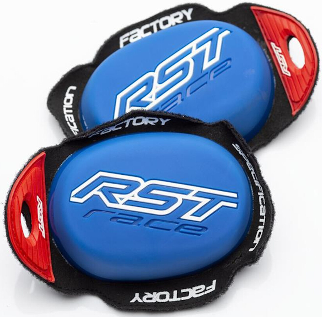 Blue RST Factory knee sliders with a smooth surface, featuring the white "RST race" logo and red accents on the sides for secure attachment.