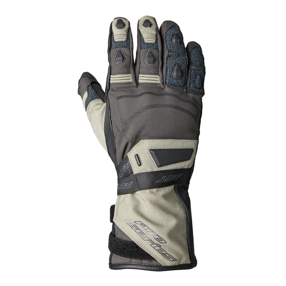 Beige, brown, and black waterproof gloves with textured grip, reinforced knuckles, and adjustable wrist strap, size M, designed for outdoor activities by RST.