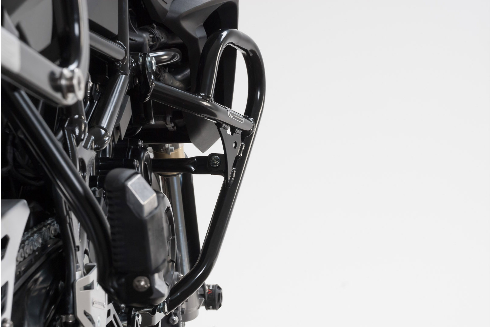 Black SW-Motech SBL crash guards made of durable metal, featuring a sleek design that integrates with motorcycle frame for enhanced protection and stability.