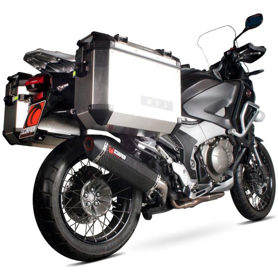Scorpion Serket Parallel Silencer with a carbon fiber sleeve, featuring a sleek black design, mounted on a motorcycle with silver aluminum panniers and a sporty rear profile.