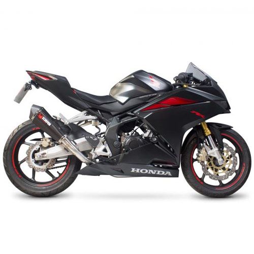 Scorpion Serket Taper Silencer with a carbon sleeve, featuring a sleek black design, mounted on a Honda motorcycle, showcasing sporty red accents and a modern profile.