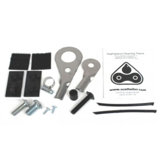 Scottoiler ESystem Spares Kit Bag containing metal brackets, screws, rubber tubing, cleaning tissue, and adhesive pads, all arranged neatly with a printed instruction sheet.