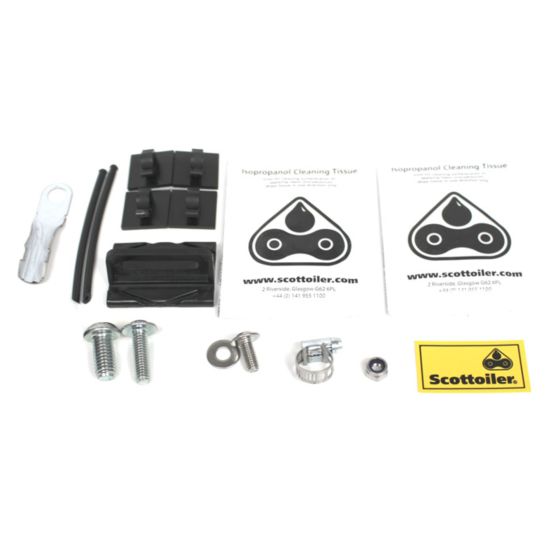 Scottoiler XSystem 2.0 Kit Bag featuring assorted components including cleaning cloths, bolts, clips, and a branded sticker, all in a mix of black and metallic finishes.
