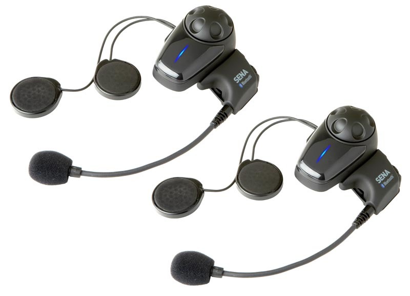 Two black Sena SMH10 Bluetooth headsets with round speakers and detachable microphones, featuring a blue LED indicator and ergonomic design for comfortable use.