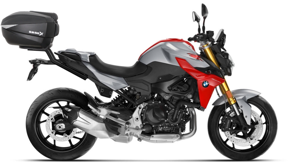 Top Master Topcase Fitting by Shad, featuring a sleek black design, designed for a 65 cm topcase, mounted on a sporty motorcycle with a red and silver color scheme.