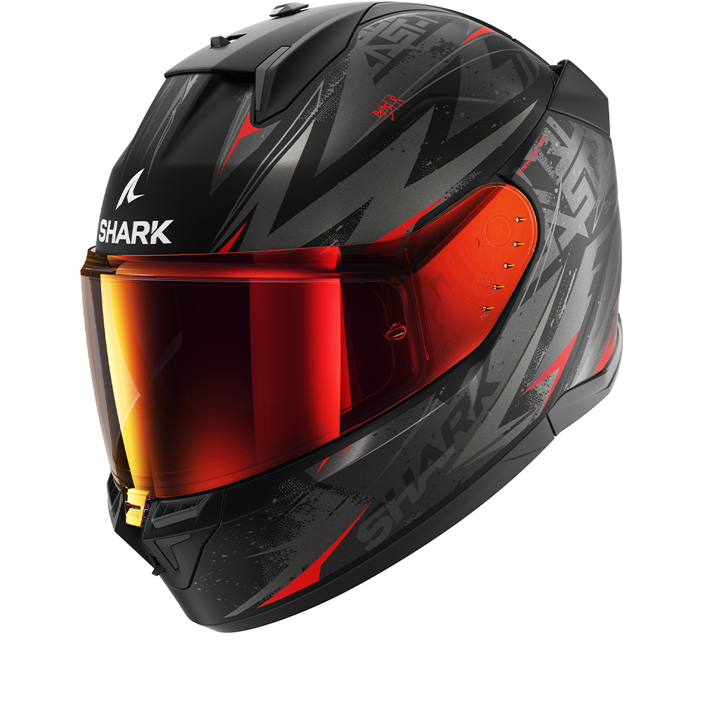Full-face helmet in black with red and gray graphic designs, featuring a tinted visor, aerodynamic shape, and Shark logo prominently displayed on the front.