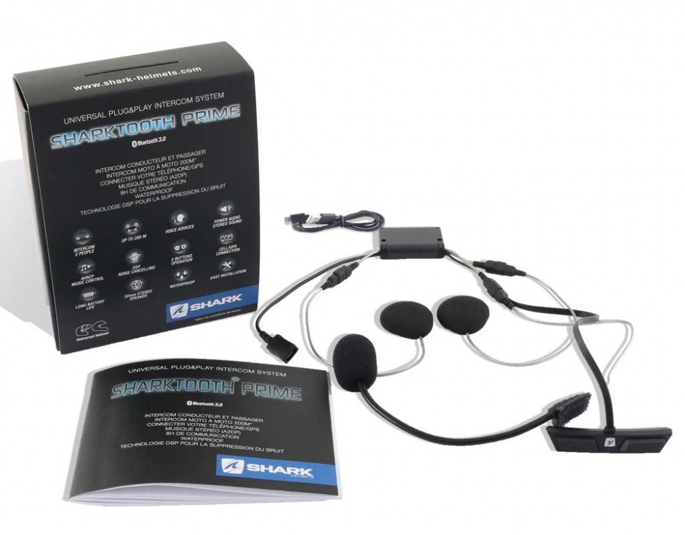 Black and silver Shark Sharktooth Prime Bluetooth communication system includes a control unit, dual speakers, and a user manual, all packaged in a branded box.