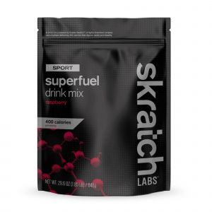 Black and silver pouch of Skratch Labs Sport Superfuel Drink Mix, featuring bold white text and a raspberry graphic, with 400 calories noted on the front.