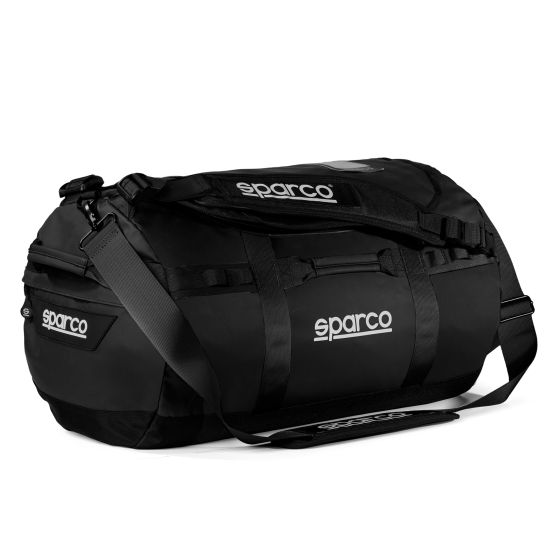 Black SPARCO DAKAR gear bag made of durable material, featuring a spacious main compartment, adjustable shoulder strap, and prominent white SPARCO logo on the side.