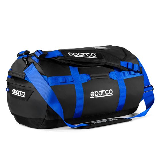 Black duffle bag with blue straps and accents, featuring a sturdy design, adjustable shoulder strap, and the Sparco logo prominently displayed on the side.