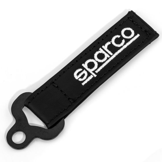 Black leather key fob featuring a prominent white "Sparco" logo, with a sturdy loop for attaching keys.