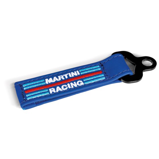 Blue leather key fob featuring "MARTINI RACING" embroidered in white and red stripes, with a black metal keyring attachment.