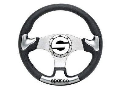 Black steering wheel with a silver metallic center and three spokes, featuring a prominent Sparco logo at the center, designed for 2003 Yamaha RXZ.