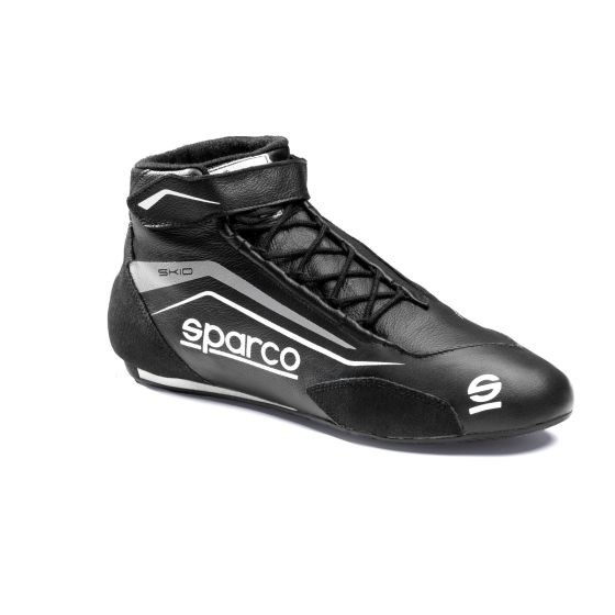 Black and white Sparco Skid race boot featuring a sleek design, lace-up front, and padded ankle support, size UK 6.5 / EUR 40.