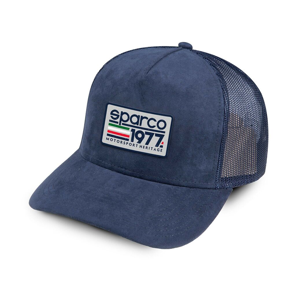 Blue Sparco trucker cap featuring a suede front panel, mesh back, and a prominent logo patch with "sparco 1977 Motorsport Heritage" in vibrant colors.