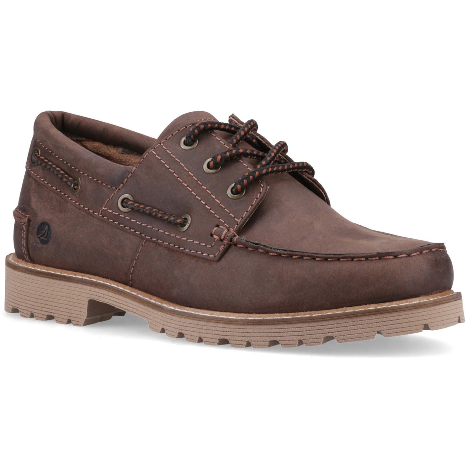 Brown leather boat shoes featuring a lace-up design, contrasting stitching, and a textured rubber sole for enhanced grip.