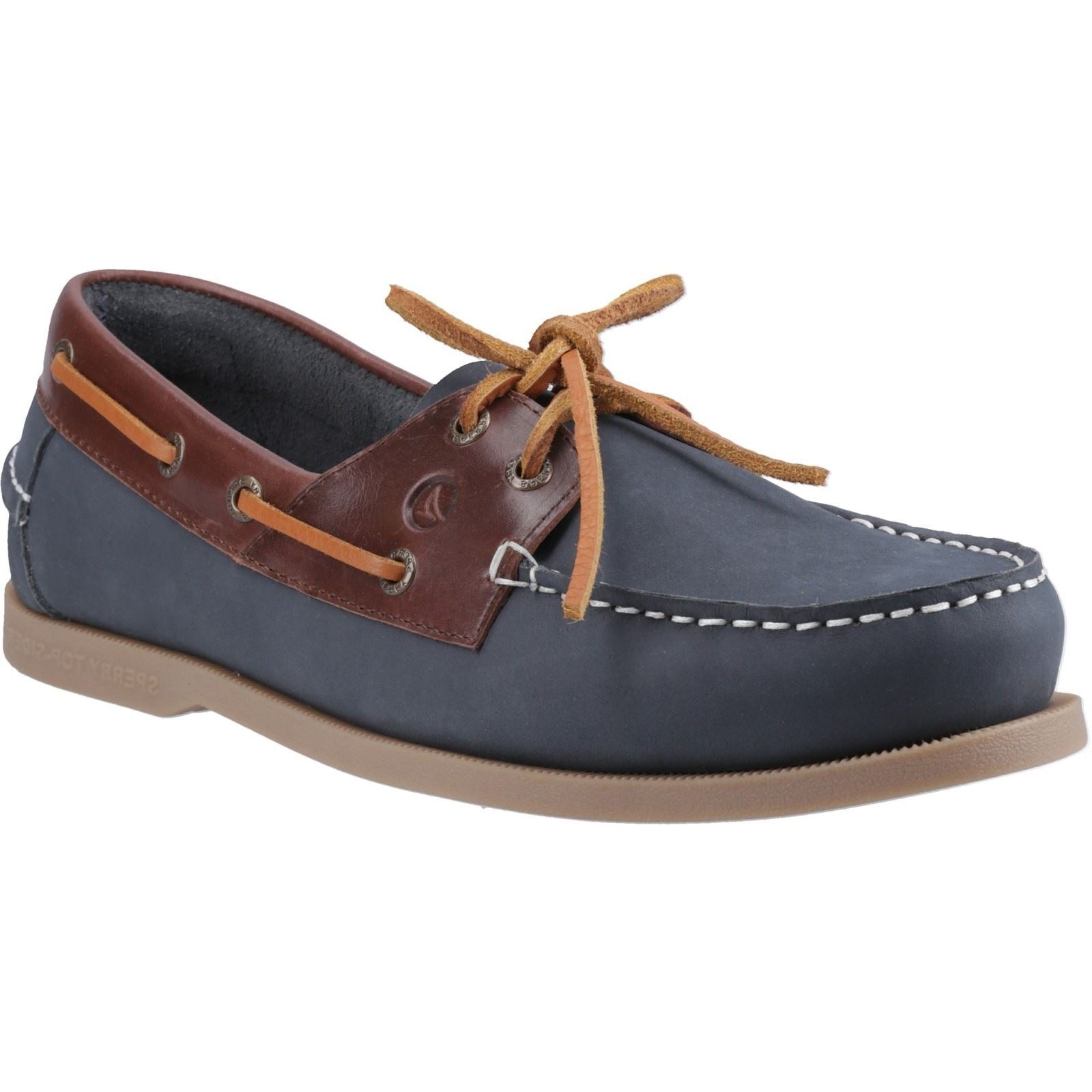 Navy and brown leather boat shoes with a classic design, featuring a lace-up front, contrasting stitching, and a rubber sole for traction.