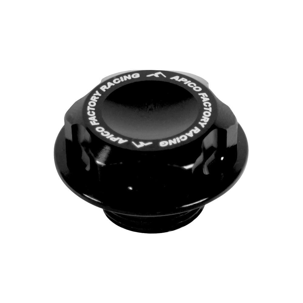 Black Apico steering stem nut with a textured top and white "Apico Factory Racing" logo, designed for various motorcycle models from 2001 to 2023.