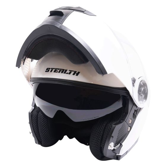 Gloss white flip-up helmet with a sleek design, featuring a tinted visor, padded interior, and the "STEALTH" logo prominently displayed on the front.