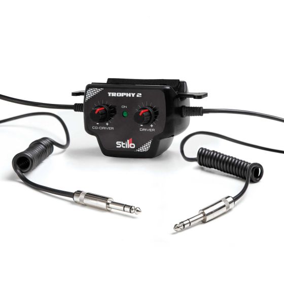 Black Stilo Trophy 2 Intercom Amplifier with two volume knobs labeled "Driver" and "Co-Driver," featuring coiled cables and 1/4-inch connectors for easy connectivity.