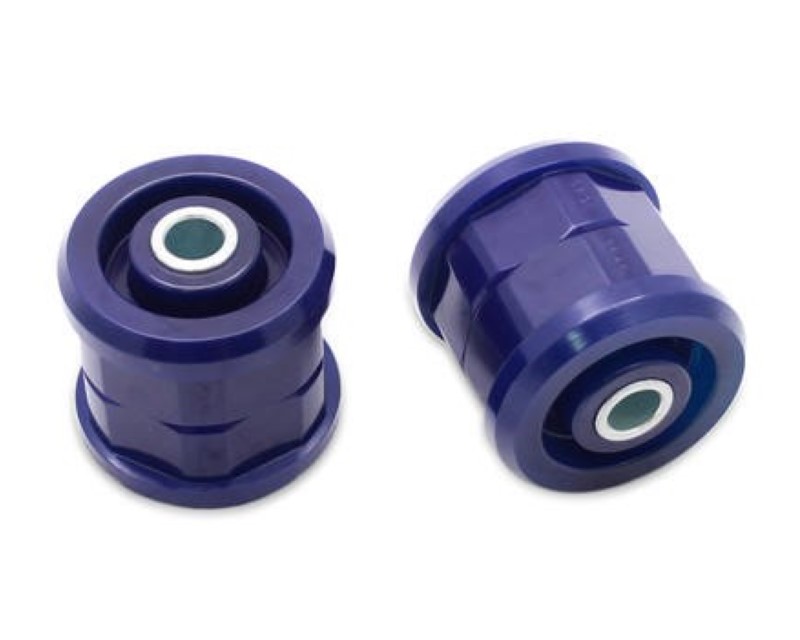 Purple polyurethane rear axle pivot bushings with a cylindrical shape, featuring a green inner sleeve and designed for Mazda models from 2011 to 2014.
