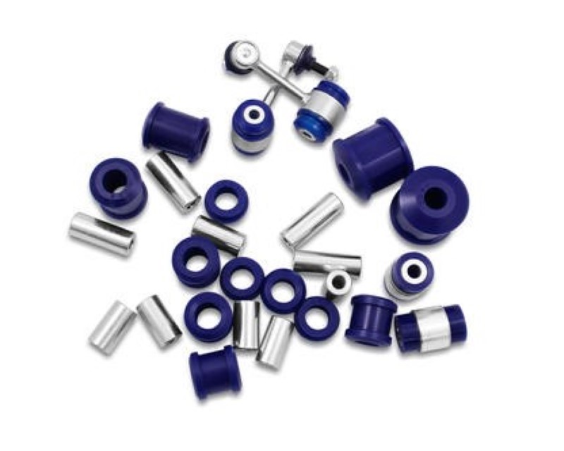 Purple polyurethane bushings and silver metal sleeves arranged in a scattered layout, designed for rear suspension compatibility with various Volkswagen models.