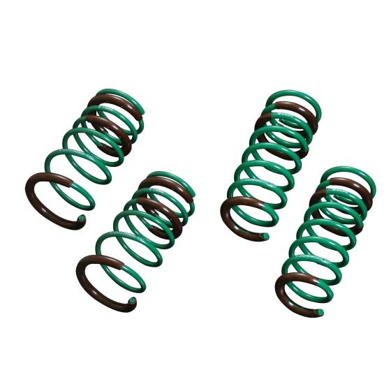Tein S.Tech Spring Kit featuring four coil springs with a green and brown color scheme, designed to lower the front by 30mm and the rear by 15mm for enhanced vehicle performance.