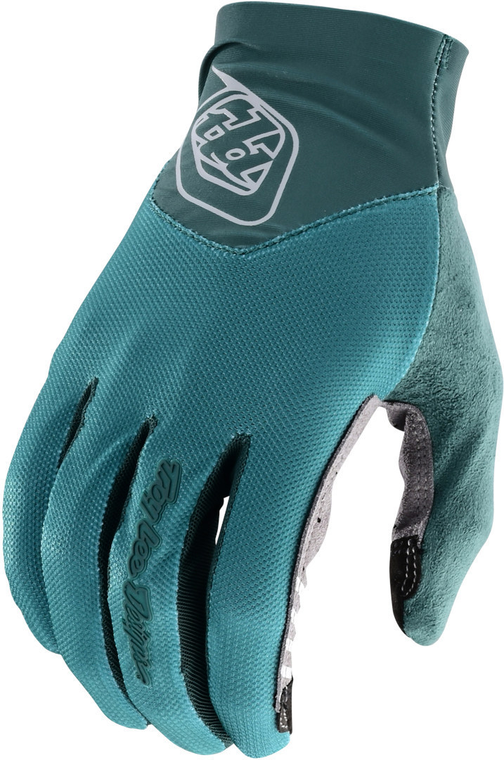 Teal textile gloves featuring a snug fit, breathable material, and a logo on the wrist, designed for comfort and grip in cycling or motocross activities.
