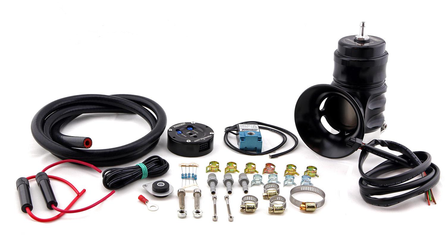 Turbosmart BOV Controller Kit in black, featuring a custom VTA Bubba valve, hoses, wiring, and various fittings for installation.