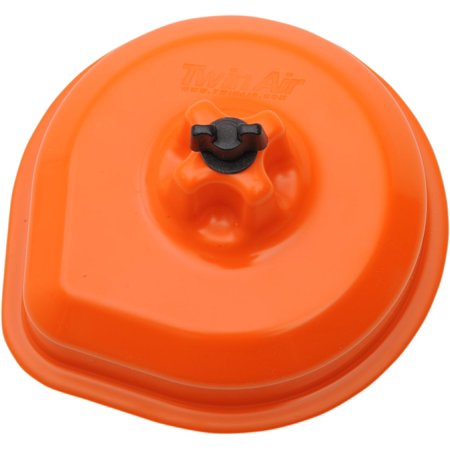 Bright orange air filter cover with a smooth, rounded design, featuring a central black fastening knob, designed for Husqvarna motorcycles by Twin Air.