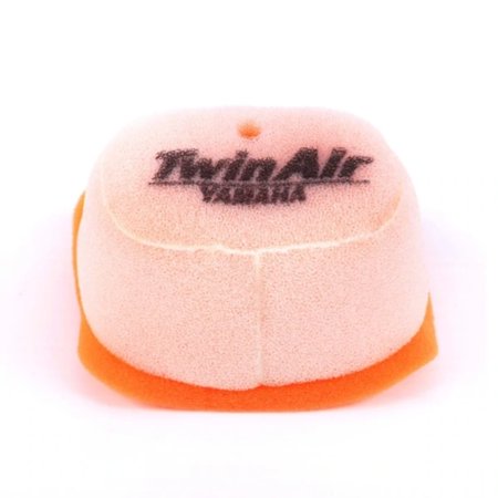 Twin Air air filter in orange and beige foam, featuring a rounded shape with a central hole and the "Twin Air" logo prominently displayed on the top.
